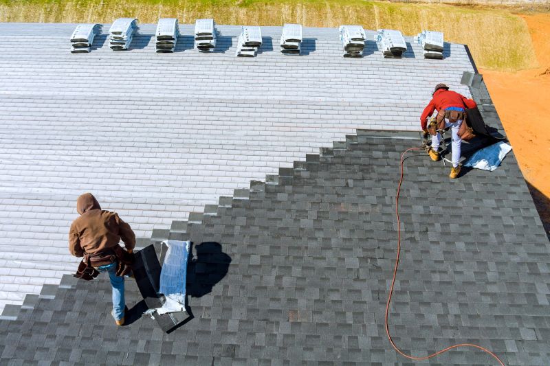 Asphalt shingle roof repair in progress